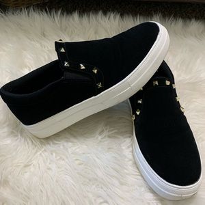 Black studded slip ons